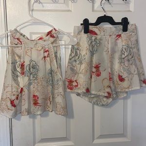 Two piece shirt/short combo, try to size with a zipper on the back of the shorts